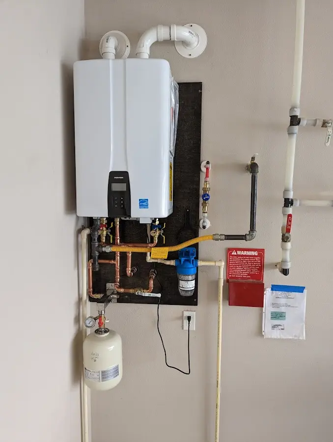 Professional plumber installing copper piping in a Orange City home